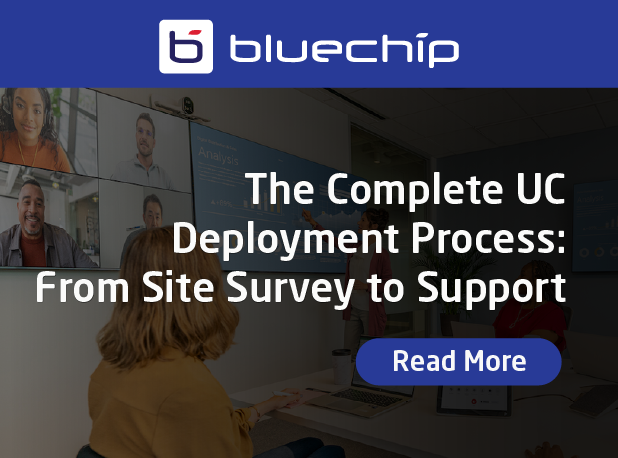Bluechip banner featuring a team in a modern meeting room with multiple video screens displaying remote participants. The text reads: ‘The Complete UC Deployment Process: From Site Survey to Support’ with a blue ‘Read More’ button below