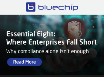 promotional graphic titled 'Essential Eight: Where Enterprises Fall Short' with the subtitle 'Why compliance alone isn't enough' and a 'Read More' link.