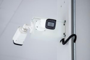Outdoor security camera mounted on wall