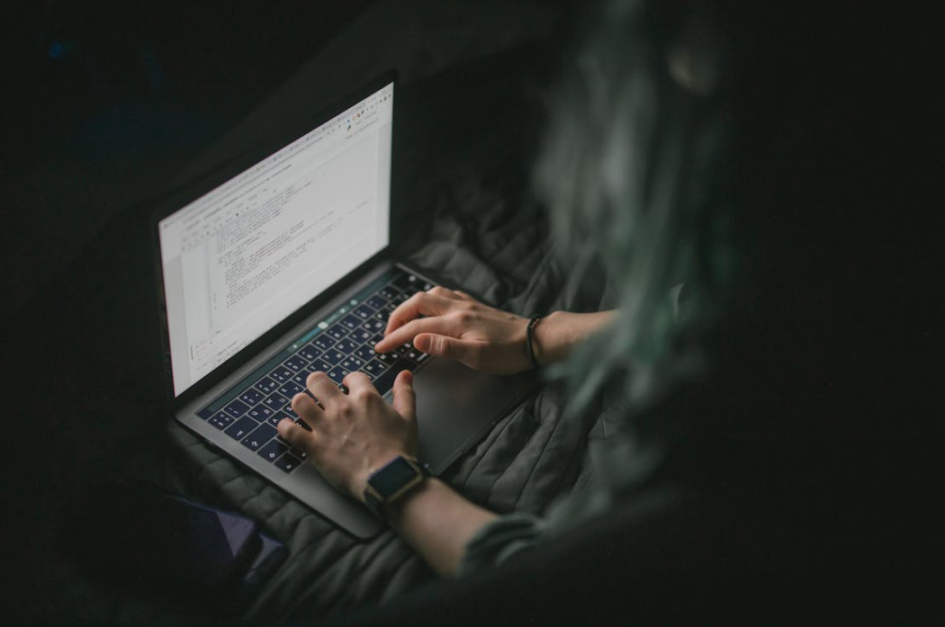 IT specialist reviewing security controls aligned with The Essential Eight framework.