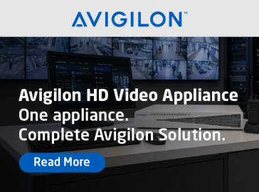 Promotional banner from Avigilon showing a video monitoring workstation with multiple surveillance screens and a desktop appliance, featuring the text “Avigilon HD Video Appliance – One appliance. Complete Avigilon Solution.” and a “Read More” button.